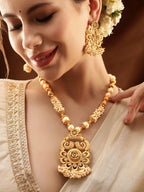 Gold-Toned Necklace Set with Radiant Charm exudes a captivating allure